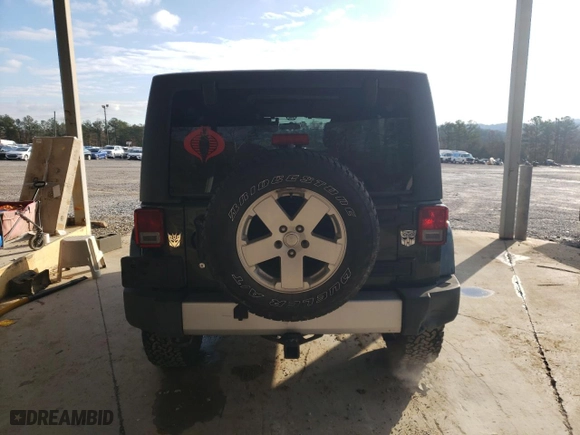 2011 Jeep Wrangler Unlimited Sahara with VIN 1J4BA5H15BL635016, listed as a Copart auction lot 84433444 with 124,217 mi miles and Salvage Title. Bid and sale history available at carsss.com. Image 6.
