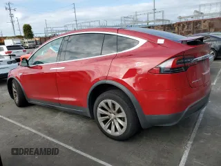 2016 Tesla Model X 70D with VIN 5YJXCAE28GF002399, listed as a Copart auction lot 50884225 with 73,113 mi miles and Salvage Title. Bid and sale history available at DreamBid. Image 2.