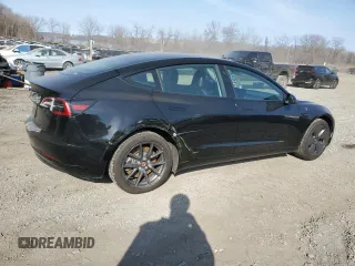 2023 Tesla Model 3 with VIN 5YJ3E1EA3PF670787, listed as a Copart auction lot 49070865 with 13,489 mi miles and Salvage title. Bid and sale history available at DreamBid. Image 3.