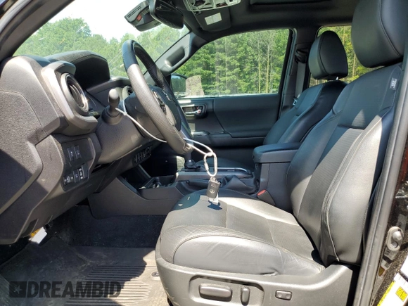 2023 Toyota Tacoma SR with VIN 3TMCZ5AN3PM571922, listed as a Copart auction lot 61872775 with 34,501 mi miles and Salvage title. Bid and sale history available at DreamBid. Image 7.