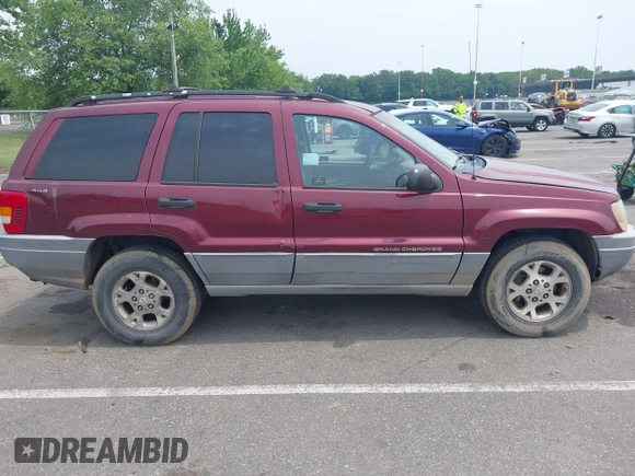 2000 Jeep Grand Cherokee Laredo z VIN 1J4GW48S2YC288439, wystawiony jako IAAI lot #42492798 z przebiegiem 272 527 mil mil oraz . Historia ofert i sprzedaży dostępna na DreamBid. Obrazek 12.