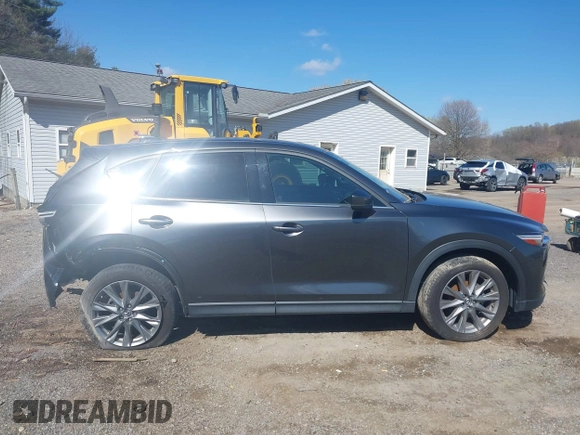2020 Mazda CX-5 Grand Touring with VIN JM3KFBDM1L0821975, listed as a IAAI auction lot 40088794 with 68,895 mi miles and . Bid and sale history available at DreamBid. Image 14.