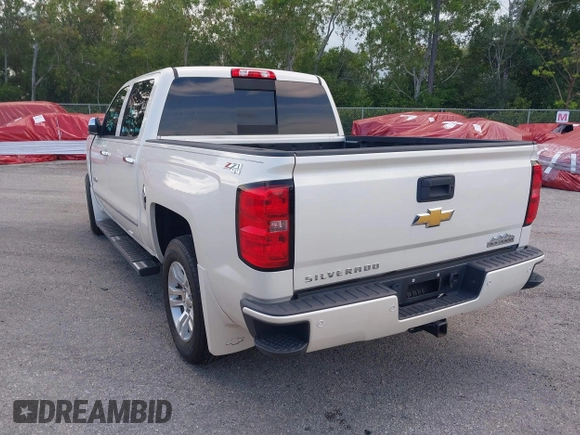 2014 Chevrolet Silverado 1500 High Country with VIN 3GCUKTEC4EG401571, listed as a IAAI auction lot 41984349 with 104,221 mi miles and . Bid and sale history available at DreamBid. Image 3.