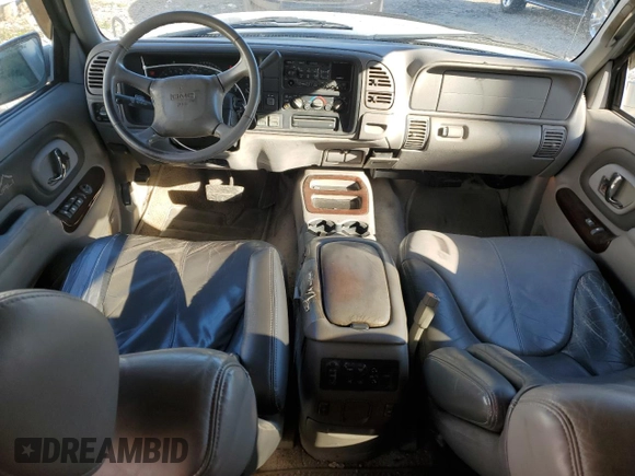 1999 GMC Denali z VIN 1GKEK13R4XR918005, wystawiony jako Copart lot #74964184 z przebiegiem 206 584 mil mil oraz Nie do naprawy. Historia ofert i sprzedaży dostępna na DreamBid. Obrazek 8.
