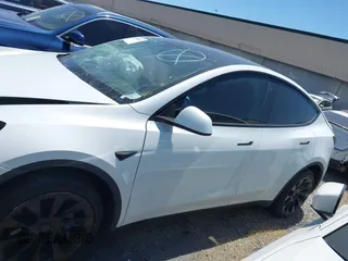2022 Tesla Model Y Long Range with VIN 7SAYGDEE8NF480939, listed as a IAAI auction lot 41808863 with 62,607 mi miles and . Bid and sale history available at carsss.com. Image 15.