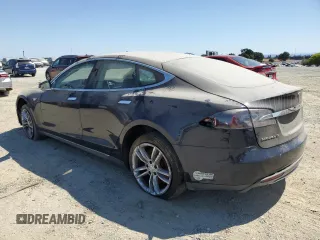 2013 Tesla Model S with VIN 5YJSA1AC9DFP10400, listed as a Copart auction lot 64096555 with 165,166 mi miles and Salvage title. Bid and sale history available at DreamBid. Image 2.