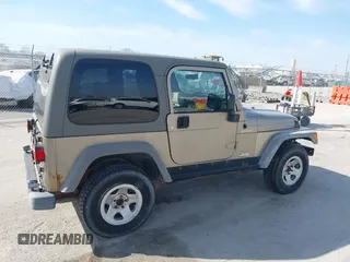 2006 Jeep Wrangler Sport Right Hand Drive with VIN 1J4F449S46P716520, listed as a IAAI auction lot 41763887 with 236,816 mi miles. Bid and sale history available at carsss.com. Image 16.
