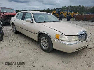 2001 Lincoln Town Car Cartier L z VIN 1LNHM85W61Y640344, wystawiony jako Copart lot #74755564 z przebiegiem Nie podano mil oraz Szkoda całkowita • Salvage title. Historia ofert i sprzedaży dostępna na DreamBid. Obrazek 4.