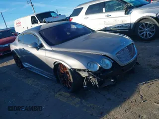 2005 Bentley Continental GT GT z VIN SCBCR63W55C027077, wystawiony jako IAAI lot #41218380 z przebiegiem 56 888 mil mil oraz . Historia ofert i sprzedaży dostępna na DreamBid. Obrazek 1.