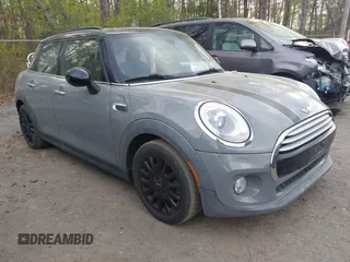 2015 MINI Hardtop 4 Door with VIN WMWXS5C57FT831660, listed as a IAAI auction lot 42057682 with 110,940 mi miles and . Bid and sale history available at DreamBid. Image 1.