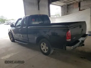 1999 Ford F-150 with VIN 1FTZX1723XNA24144, listed as a Copart auction lot 58071155 with 320,829 mi miles and Salvage title. Bid and sale history available at DreamBid. Image 2.