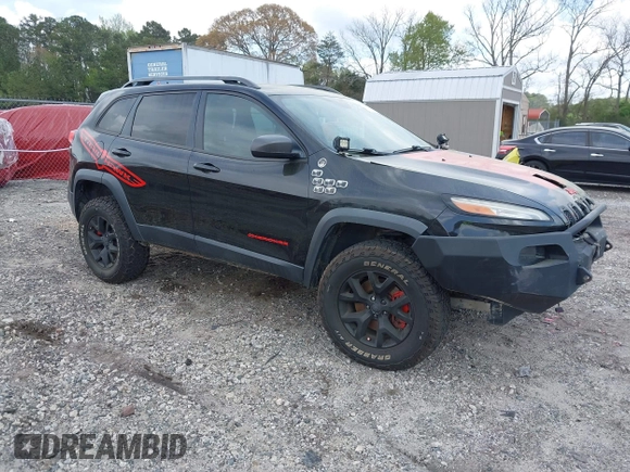 2015 Jeep Cherokee Trailhawk with VIN 1C4PJMBS5FW792184, listed as a IAAI auction lot 41827106 with 132,752 mi miles. Bid and sale history available at carsss.com. Image 1.