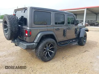 2021 Jeep Wrangler Unlimited Sport S with VIN 1C4HJXDG2MW700461, listed as a IAAI auction lot 41894307 with 82,454 mi miles. Bid and sale history available at carsss.com. Image 4.