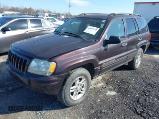 2004 Jeep Grand Cherokee with VIN 1J8GX48S24C266933, listed as a IAAI auction lot 41497122 with 200,899 mi miles and . Bid and sale history available at DreamBid. Image 2.