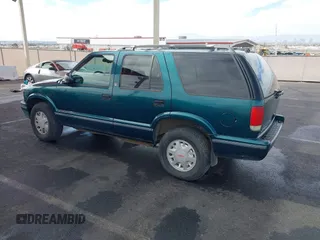 1997 GMC Jimmy SLS with VIN 1GKDT13W7V2516192, listed as a IAAI auction lot 41442979 with 154,518 mi miles. Bid and sale history available at carsss.com. Image 3.