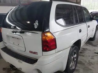 2004 GMC Envoy SLE with VIN 1GKDS13S642118163, listed as a IAAI auction lot 41809472 with 234,353 mi miles. Bid and sale history available at carsss.com. Image 4.