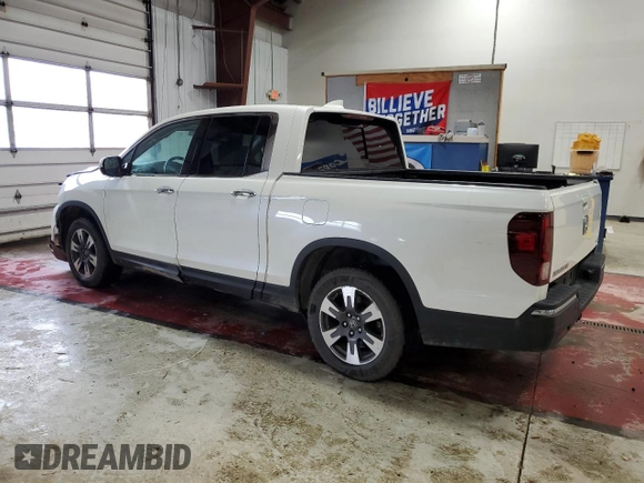 2017 Honda Ridgeline RTL-E with VIN 5FPYK3F72HB002890, listed as a Copart auction lot 57699735 with 128,813 mi miles and Salvage title. Bid and sale history available at DreamBid. Image 2.