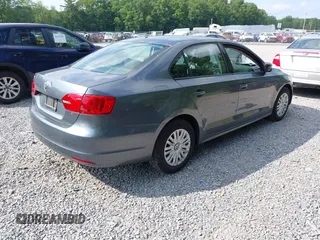 2014 Volkswagen Jetta S with VIN 3VW2K7AJ2EM352047, listed as a IAAI auction lot 42556420 with 104,798 mi miles and . Bid and sale history available at DreamBid. Image 4.