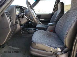 1999 Jeep Cherokee Sport z VIN 1J4FF68S8XL604061, wystawiony jako Copart lot #53175345 z przebiegiem 206 698 mil mil oraz Nie do naprawy • Non repairable. Historia ofert i sprzedaży dostępna na DreamBid. Obrazek 7.