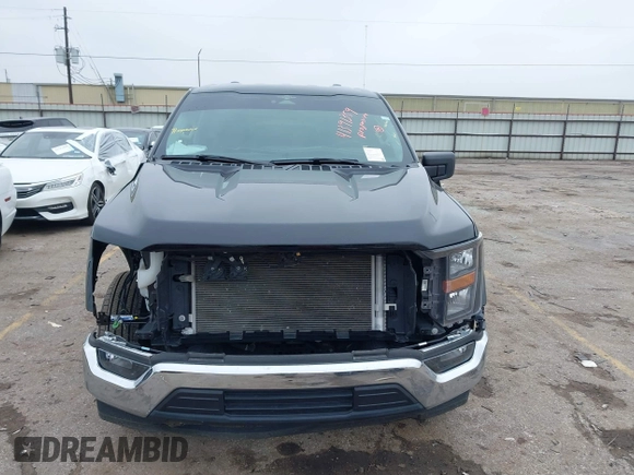 2023 Ford F-150 XL with VIN 1FTMF1C50PKE33412, listed as a IAAI auction lot 41391359 with 19,344 mi miles and . Bid and sale history available at carsss.com. Image 13.