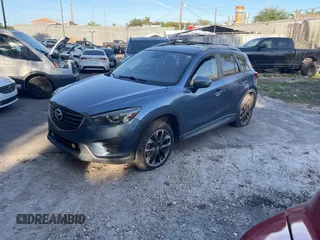 2016 Mazda CX-5 Grand Touring with VIN JM3KE4DY9G0673789, listed as a IAAI auction lot 42196841 with 98,622 mi miles and . Bid and sale history available at DreamBid. Image 2.