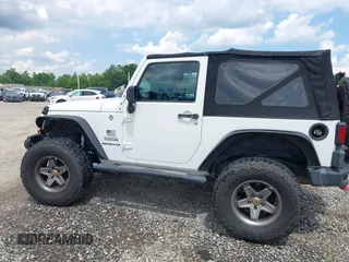 2012 Jeep Wrangler Sport z VIN 1C4AJWAG5CL171961, wystawiony jako IAAI lot #42590232 z przebiegiem 126 372 mil mil oraz . Historia ofert i sprzedaży dostępna na DreamBid. Obrazek 14.