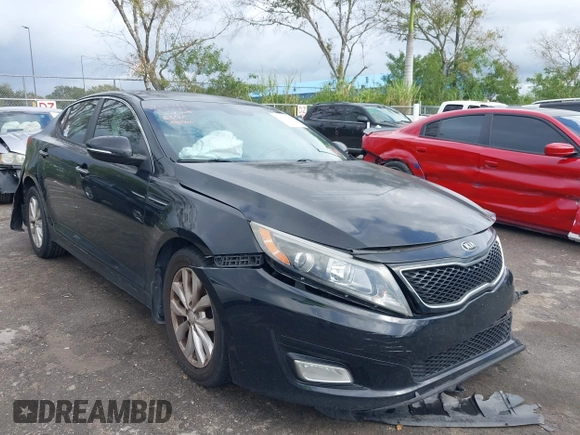 2015 Kia Optima EX z VIN 5XXGN4A72FG354497, wystawiony jako IAAI lot #42110643 z przebiegiem 117 751 mil mil oraz . Historia ofert i sprzedaży dostępna na DreamBid. Obrazek 1.