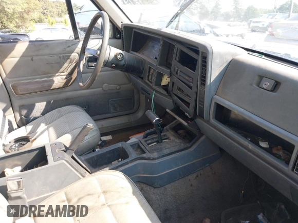 1990 Jeep Cherokee with VIN 1J4FJ38L1LL100497, listed as a IAAI auction lot 37253812 with 214,943 mi miles and . Bid and sale history available at DreamBid. Image 5.