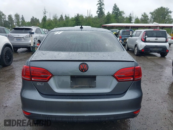 2014 Volkswagen Jetta GLI z VIN 3VW4T7AJ2EM208598, wystawiony jako IAAI lot #42381855 z przebiegiem 82 761 mil mil oraz . Historia ofert i sprzedaży dostępna na DreamBid. Obrazek 16.
