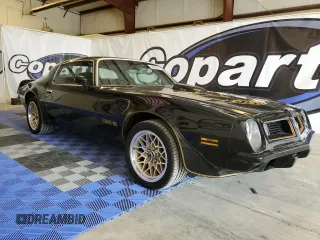 1975 Pontiac Firebird z VIN 2W87S5N561452, wystawiony jako Copart lot #64986614 z przebiegiem 73 434 mil mil oraz Tytuł czysty. Historia ofert i sprzedaży dostępna na DreamBid. Obrazek 4.
