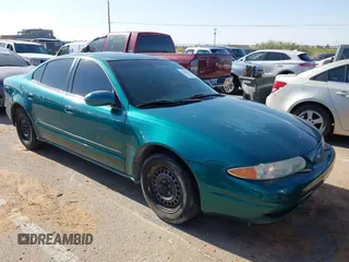 1999 Oldsmobile Alero GL z VIN 1G3NL52T0XC354966, wystawiony jako IAAI lot #42259258 z przebiegiem Nie podano mil oraz . Historia ofert i sprzedaży dostępna na DreamBid. Obrazek 1.