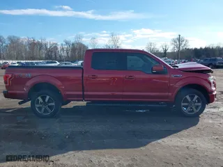 2015 Ford F-150 XLT w/HD Payload Pkg with VIN 1FTFW1EF2FFB76243, listed as a IAAI auction lot 41150866 with 124,478 mi miles. Bid and sale history available at carsss.com. Image 13.