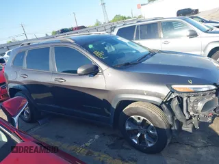 2014 Jeep Cherokee Trailhawk with VIN 1C4PJMBS6EW167517, listed as a IAAI auction lot 41947552 with 233,572 mi miles. Bid and sale history available at carsss.com. Image 14.