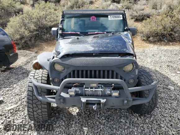 2010 Jeep Wrangler Unlimited Sahara with VIN 1J4HA5H13AL182071, listed as a Copart auction lot 51696665 with 178,026 mi miles and Salvage Title. Bid and sale history available at carsss.com. Image 5.