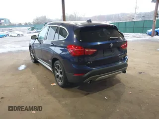 2019 BMW X1 xDrive28i with VIN WBXHT3C55K5L37338, listed as a IAAI auction lot 41934461 with 87,913 mi miles. Bid and sale history available at carsss.com. Image 3.