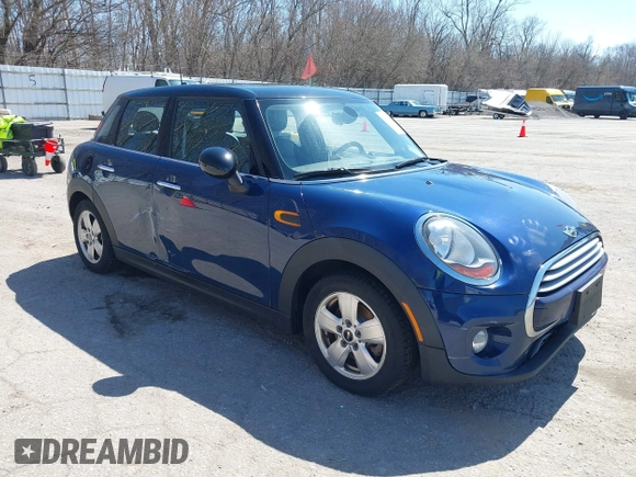 2015 MINI Hardtop 4 Door z VIN WMWXS5C58FT829805, wystawiony jako IAAI lot #42023026 z przebiegiem 141 330 mil mil oraz . Historia ofert i sprzedaży dostępna na DreamBid. Obrazek 1.