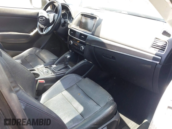 2016 Mazda CX-5 Grand Touring z VIN JM3KE2DY6G0900005, wystawiony jako IAAI lot #42311162 z przebiegiem 80 758 mil mil oraz . Historia ofert i sprzedaży dostępna na DreamBid. Obrazek 5.