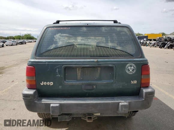 1993 Jeep Grand Cherokee Laredo with VIN 1J4GZ58Y8PC513026, listed as a Copart auction lot 57001465 with 135,242 mi miles and Clean title. Bid and sale history available at DreamBid. Image 6.