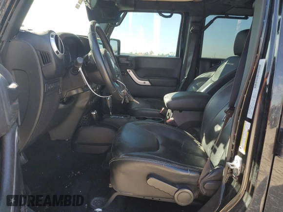 2015 Jeep Wrangler Unlimited Rubicon Hard Rock with VIN 1C4HJWFG1FL710264, listed as a Copart auction lot 47563975 with 96,737 mi miles and Salvage title. Bid and sale history available at DreamBid. Image 7.