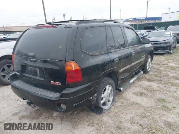 2006 GMC Envoy SLT with VIN 1GKDS13S462241866, listed as a IAAI auction lot 41943322 with 90,695 mi miles. Bid and sale history available at carsss.com. Image 4.