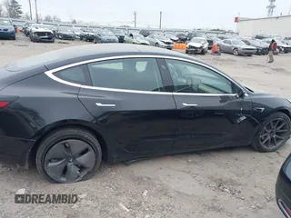 2019 Tesla Model 3 Mid Range with VIN 5YJ3E1EA5KF297213, listed as a IAAI auction lot 41361412 with 93,801 mi miles and . Bid and sale history available at carsss.com. Image 13.