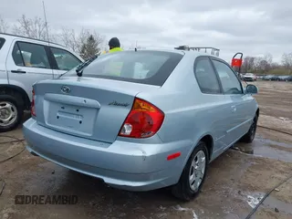 2003 Hyundai Accent GL with VIN KMHCG35C23U264360, listed as a IAAI auction lot 42033316 with 100,991 mi miles. Bid and sale history available at carsss.com. Image 4.