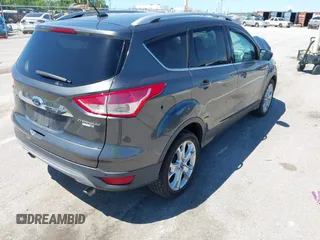 2015 Ford Escape Titanium z VIN 1FMCU9J92FUB01007, wystawiony jako IAAI lot #42319246 z przebiegiem 90 782 mil mil oraz . Historia ofert i sprzedaży dostępna na DreamBid. Obrazek 4.