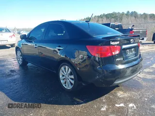 2012 Kia Forte SX with VIN KNAFW4A3XC5563571, listed as a IAAI auction lot 41590629 with 115,993 mi miles. Bid and sale history available at carsss.com. Image 3.