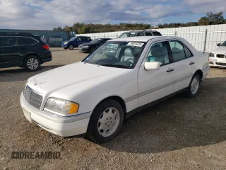 1995 Mercedes-Benz C with VIN WDBHA28E1SF151911, listed as a Copart auction lot 76814424 with 128,184 mi miles and Clean Title. Bid and sale history available at carsss.com. Image 1.