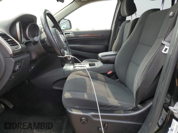 2011 Jeep Grand Cherokee Laredo with VIN 1J4RR4GGXBC567450, listed as a Copart auction lot 60056085 with 165,077 mi miles and Salvage title. Bid and sale history available at DreamBid. Image 7.