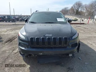 2015 Jeep Cherokee North with VIN 1C4PJMCS7FW544792, listed as a IAAI auction lot 41801573 with 140,575 mi miles. Bid and sale history available at carsss.com. Image 12.