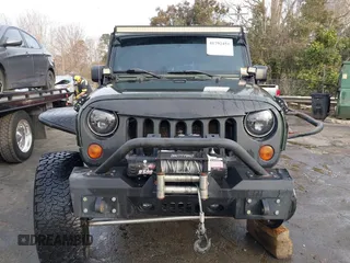 2009 Jeep Wrangler Rubicon z VIN 1J8GA64169L743008, wystawiony jako IAAI lot #41792451 z przebiegiem 142 414 mil mil oraz . Historia ofert i sprzedaży dostępna na DreamBid. Obrazek 12.