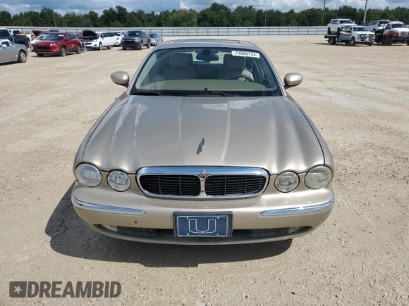 2004 Jaguar XJ with VIN SAJWA71C24SG28164, listed as a Copart auction lot 73968134 with 0 mi miles and Salvage Title. Bid and sale history available at carsss.com. Image 5.
