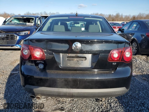 2009 Volkswagen Jetta z VIN 3VWHZ71K59M088780, wystawiony jako Copart lot #87115414 z przebiegiem 88 197 mil mil oraz Czysty tytuł • Clean title. Historia ofert i sprzedaży dostępna na DreamBid. Obrazek 6.